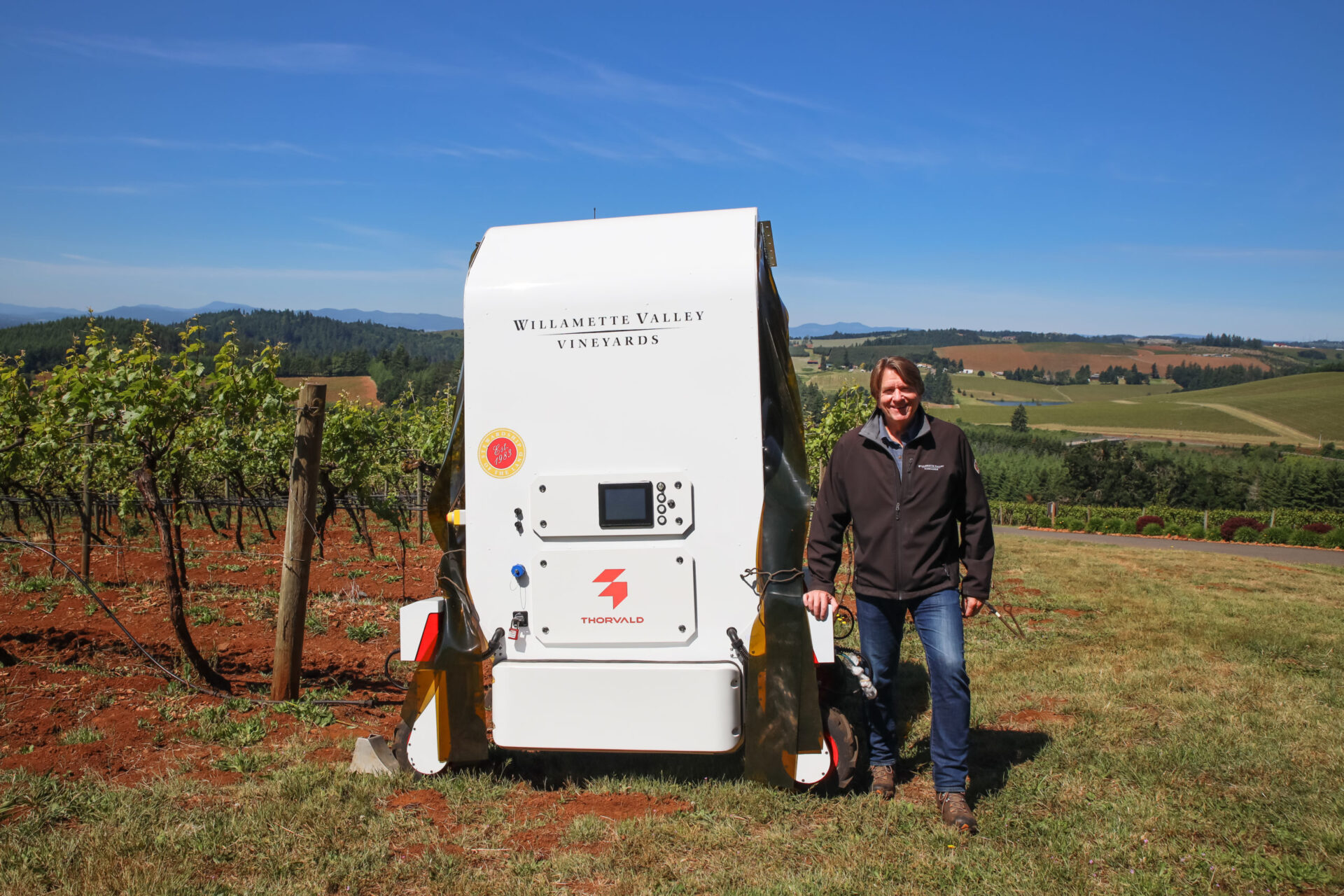 Willamette Valley Vineyards CEO_Founder Jim Bernau with UV-C Robot