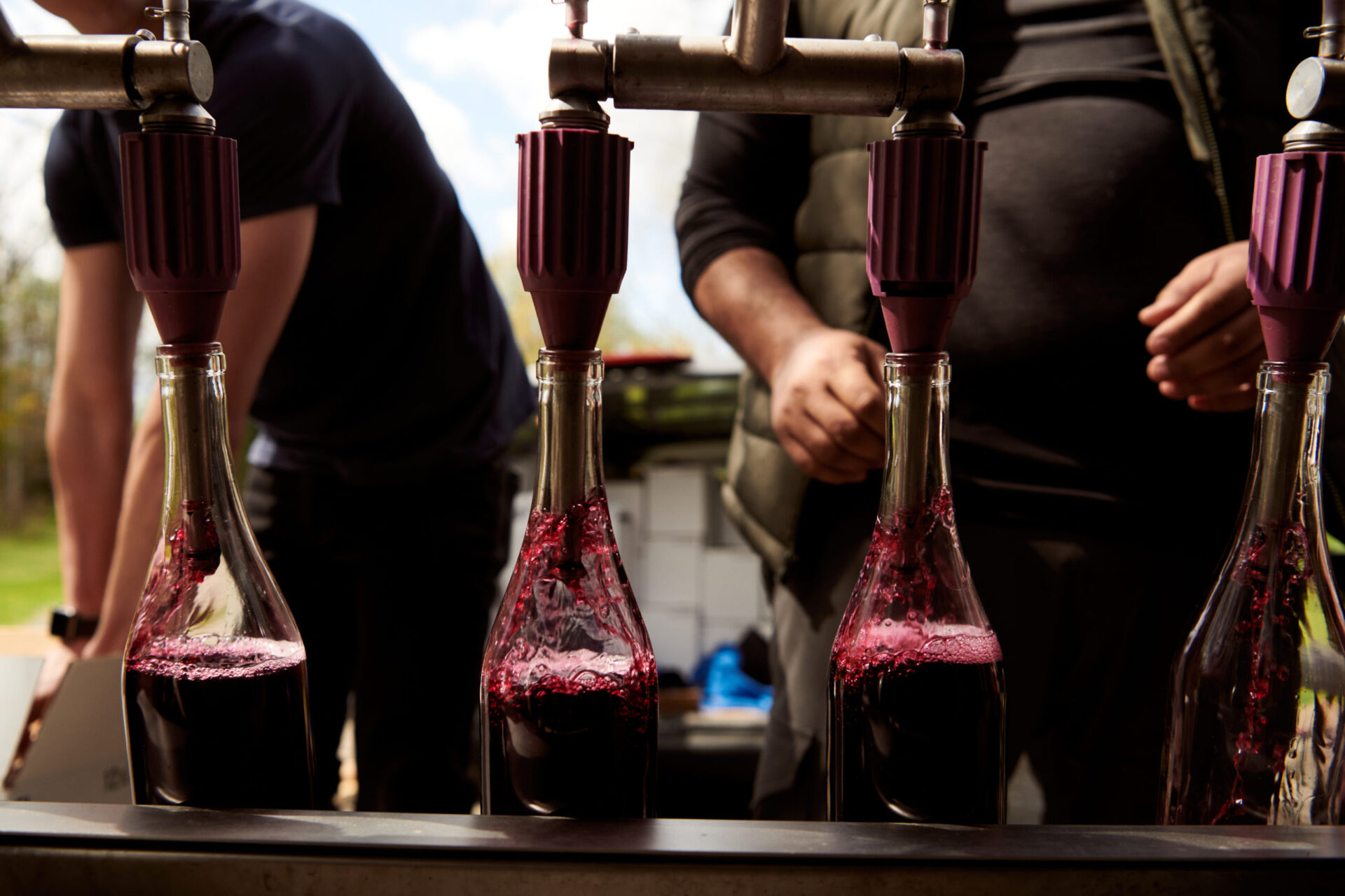 Good Goods' business model is built on sanitizing and re-filling used wine bottles in an effort to reduce waste. / Photo Courtesy Good Goods