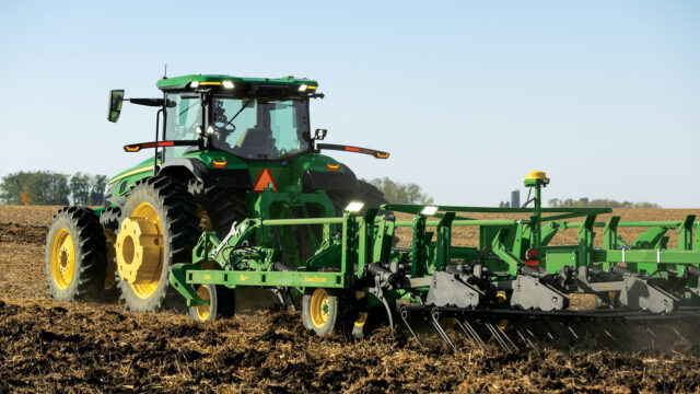 John Deere 8R Autonomous tractor tilling a field